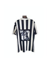 Juventus FC home football shirt back with large 10 print, black and white vertical stripes