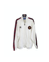 White Manchester United track jacket with zip front, red/black shoulder trim and crest