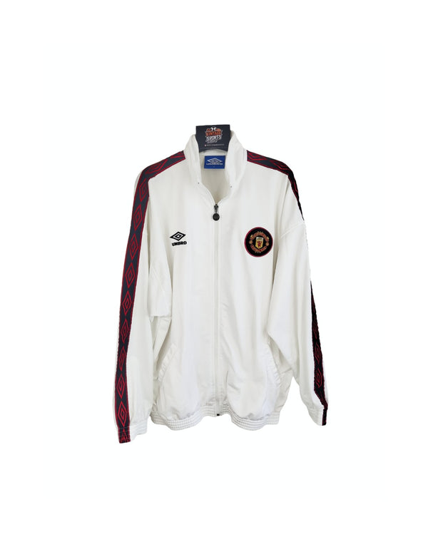 White Manchester United track jacket with zip front, red/black shoulder trim and crest